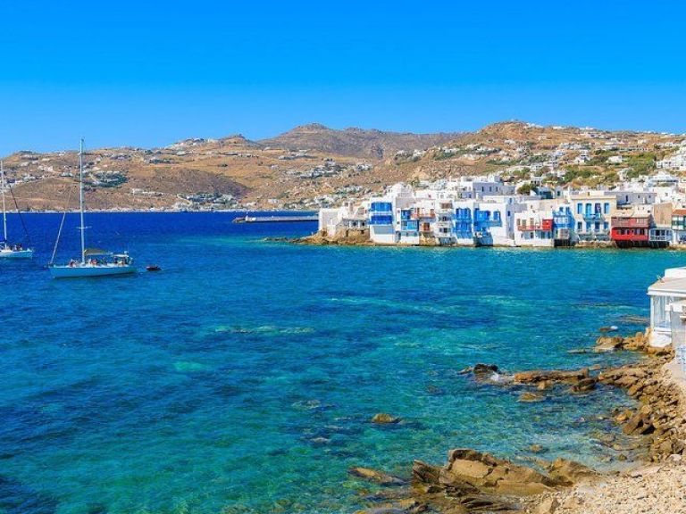 Day Private Cruise to Caldera & Hot Springs via White & Black beach from Santorini.