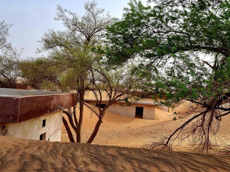 The Ghost Village Safari Tour with Dune Bashing and Sand-boarding.