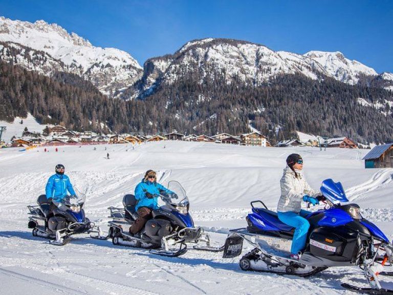 Dolomites Day Trip with snowmobile experience.