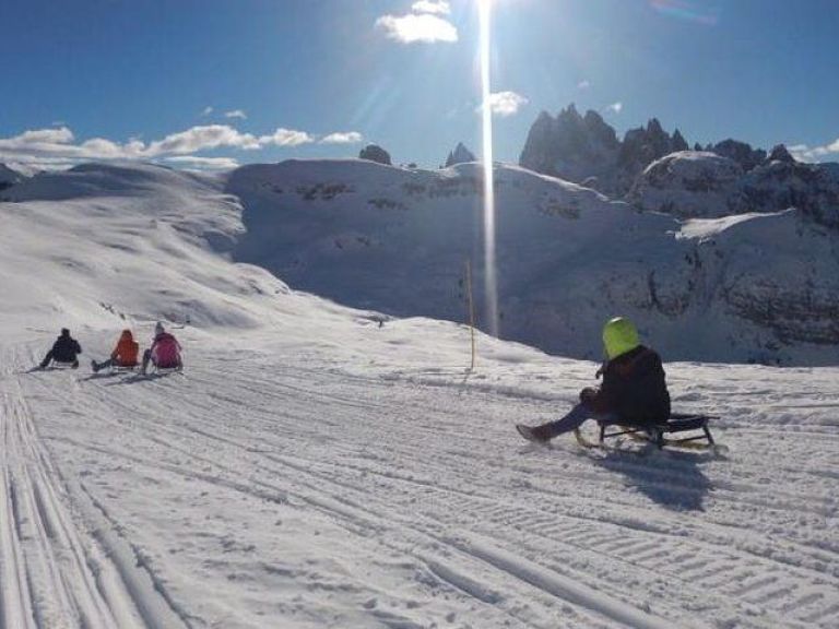 Dolomites Day Trip with snowmobile experience.