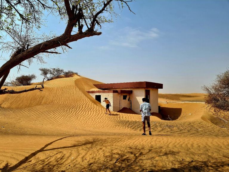 Private Ghost Village Safari Tour with Dune Bashing and Sandboarding.