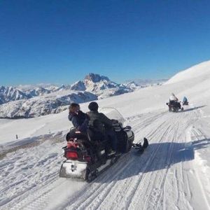 Dolomites Day Trip with snowmobile experience.