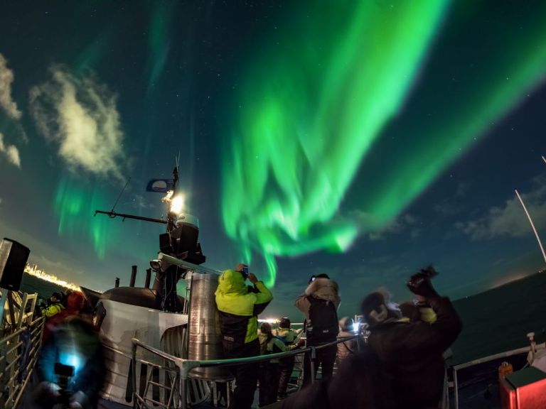 Northern Lights by Boat with a Backup Plan: Sail out from Reykjavík in search for the beautiful Aurora Borealis! It only takes us 10-15 minutes to sail into the dark, away from the light pollution from the city, to a perfect location for viewing the magical northern lights and starry sky. Enjoy the peace and quiet out in Faxaflói Bay.