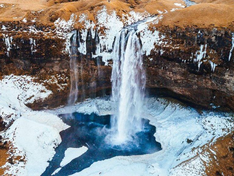 Private South Coast Tour: Join us for the best one-day South Iceland Tour available! Experience the wonders of several magnificent waterfalls along the south coast, such as Seljalandsfoss, Skógafoss, and Gljúfrabúi, some of which you can even explore from behind! Afterwards, take a walk on an other-worldly black sand beach at Reynisfjara, which is home to countless puffin families during the summer season.