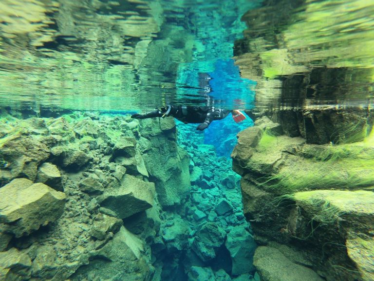 Snorkeling in Silfra with free pick up from Reykjavik and free photos.