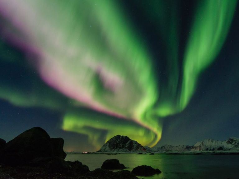 Northern Lights by Boat: Hunting the northern lights on the North Atlantic ocean is an amazing experience. Sailing away from the coastline of Reykjavik and seeing the Aurora Borealis out on the ocean with beautiful mountains and the city in the background is something to remember.