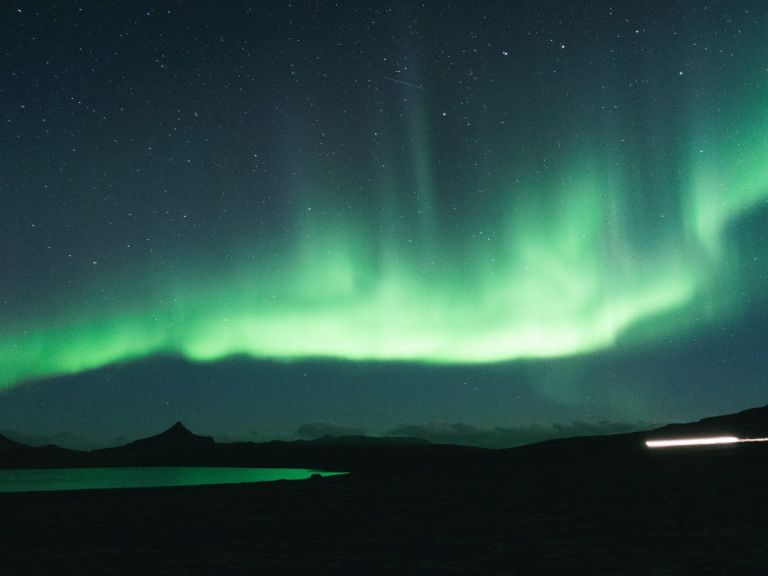 Northern Lights by Boat: Hunting the northern lights on the North Atlantic ocean is an amazing experience. Sailing away from the coastline of Reykjavik and seeing the Aurora Borealis out on the ocean with beautiful mountains and the city in the background is something to remember.