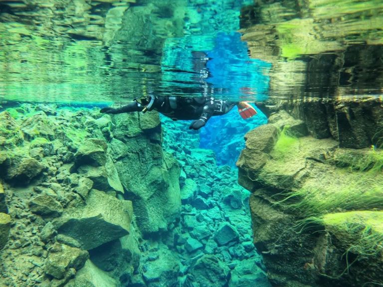 Snorkeling in Silfra with free pick up from Reykjavik and free photos.