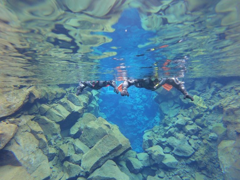 Snorkeling in Silfra with free pick up from Reykjavik and free photos.