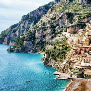 Positano & Amalfi - The tortuous street slips over deep gorges and runs down toward the beach and climbs up again along a...