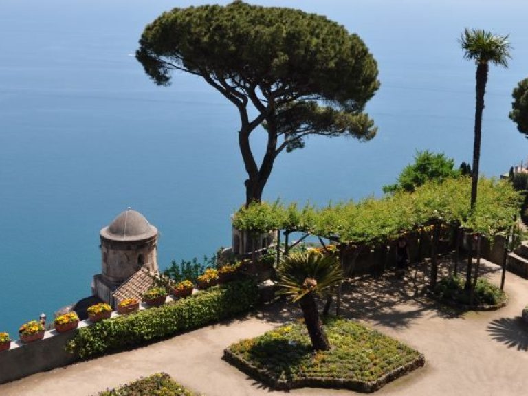 Positano & Amalfi - The tortuous street slips over deep gorges and runs down toward the beach and climbs up again along a...