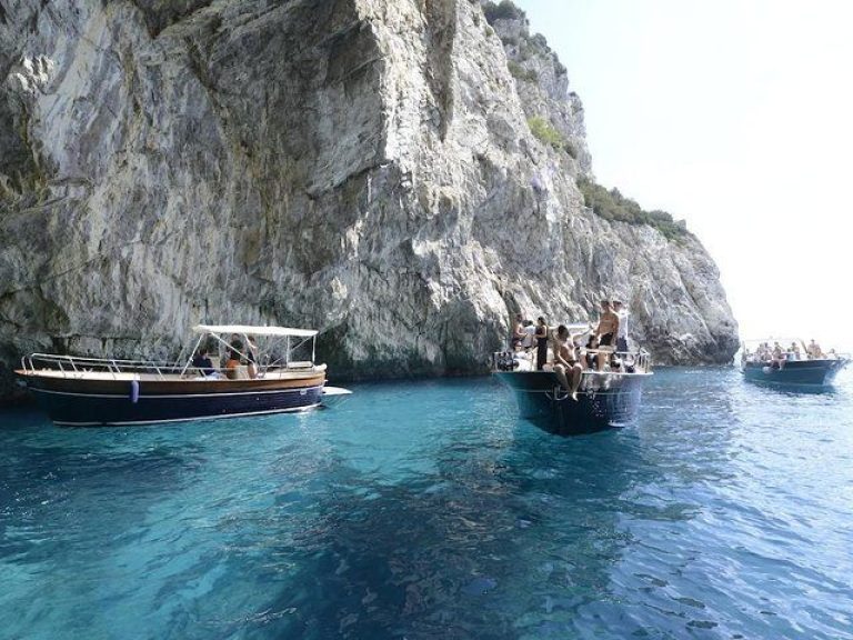 Li Galli Islands and Capri boat tour - Meet your skipper at 10:15am at the port of Amalfi and board on a typical “gozzo”...