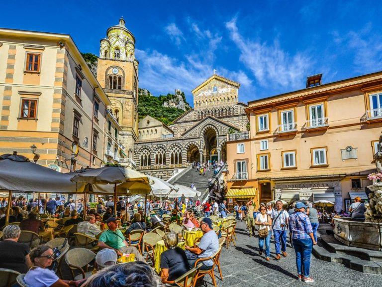 Positano & Amalfi - The tortuous street slips over deep gorges and runs down toward the beach and climbs up again along a...