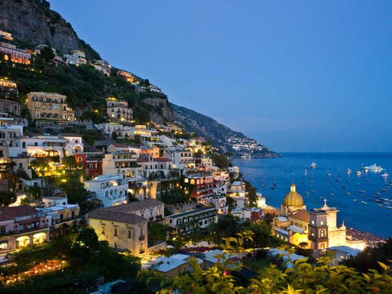 Positano & Amalfi - The tortuous street slips over deep gorges and runs down toward the beach and climbs up again along a...