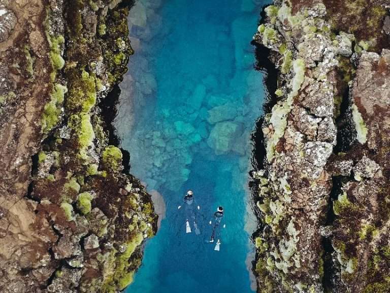 Above & Below: Silfra Snorkeling & Fly Over Iceland - with Snorkeling Photos - How about starting the day with snorkeling Silfra, a freshwater fissure and then "fly" around beautiful Iceland? Then we recommend the combination of Snorkeling and Fly Over Iceland adventure combo!