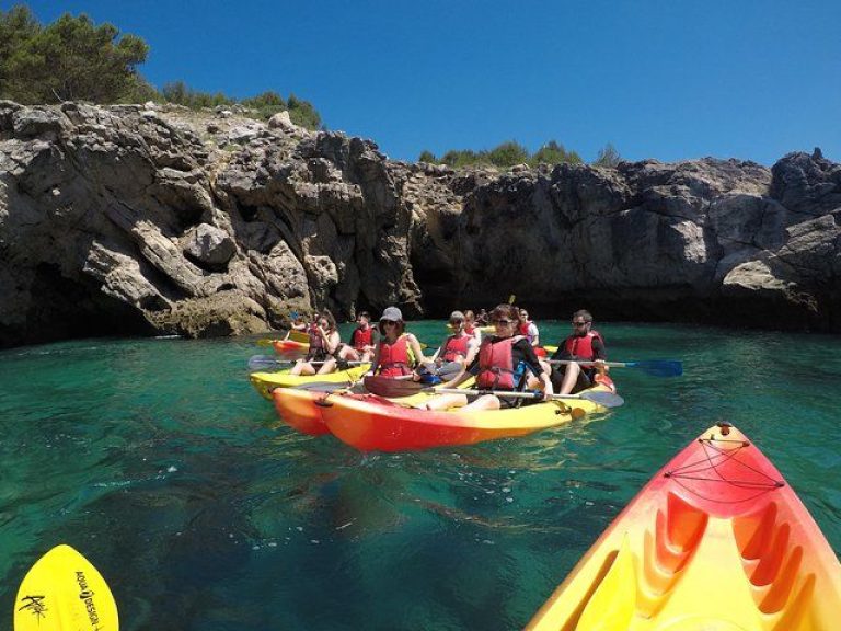 Kayak Tour along Sesimbra: Join our intimate group Kayak tour in the beautiful Arrábida Natural Park. Our maximum of five tandem kayaks per group makes it perfect for families or friends. All necessary equipment, including life vests, paddles, water-resistant bags, and comfortable kayak seats, is provided. We'll start the tour in the charming village of Sesimbra, where we'll brief you on paddling techniques and the itinerary.
