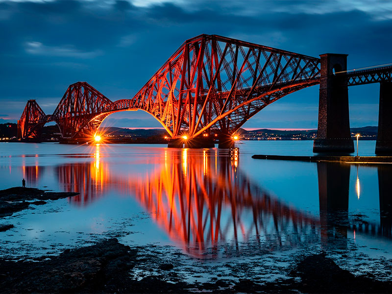 Steeped in history and architectural brilliance, the Forth Bridge stands as a captivating testament to human ingenuity. This UNESCO World Heritage Site graces the picturesque landscape of Edinburgh, UK, attracting visitors from around the globe.