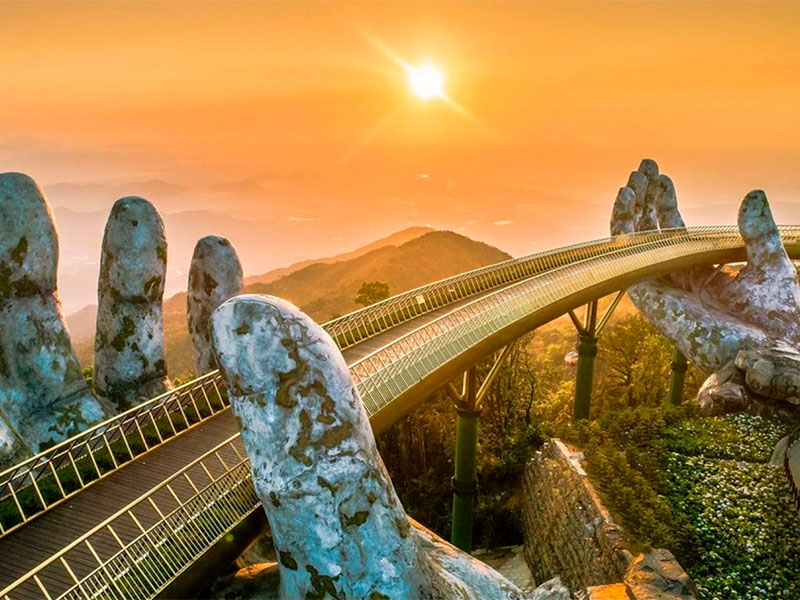 Unveil the magic of Vietnam's crown jewel, the Golden Bridge (Cầu Vàng). Nestled amidst the lush landscapes of Da Nang, this architectural marvel is a testament to human creativity and nature's beauty. Let us take you on a journey to this captivating attraction that has captured the hearts of travelers worldwide.