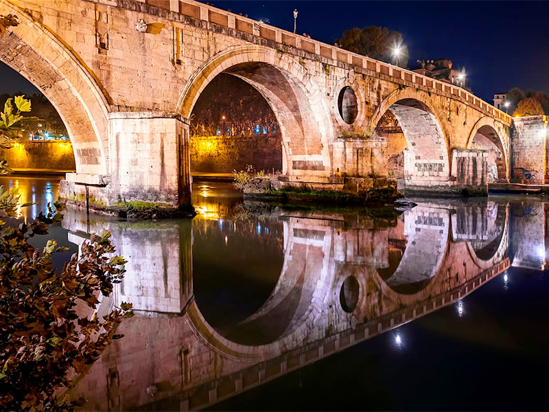 Venture into the heart of Rome and discover Ponte Cestio, a beautiful bridge with a story that spans centuries. Nestled between the vibrant Trastevere District and the historic Tiber Island, Ponte Cestio is a testament to Rome's architectural marvels.