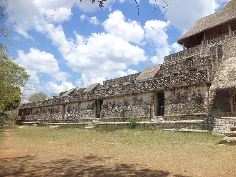 Yucatan Travel Guide - Ek Balam: This less-visited Mayan site provides a peaceful atmosphere for exploring well-preserved sculptures and buildings. The Acropolis, the largest structure, contains fascinating friezes and offers panoramic views of the surrounding jungle.