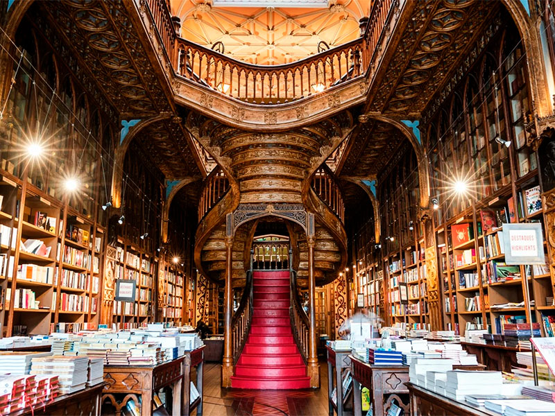 Porto Travel Guide: Step into the magical world of Livraria Lello, one of the most beautiful bookstores globally. With its ornate woodwork and grand staircase, it’s a paradise for bibliophiles.