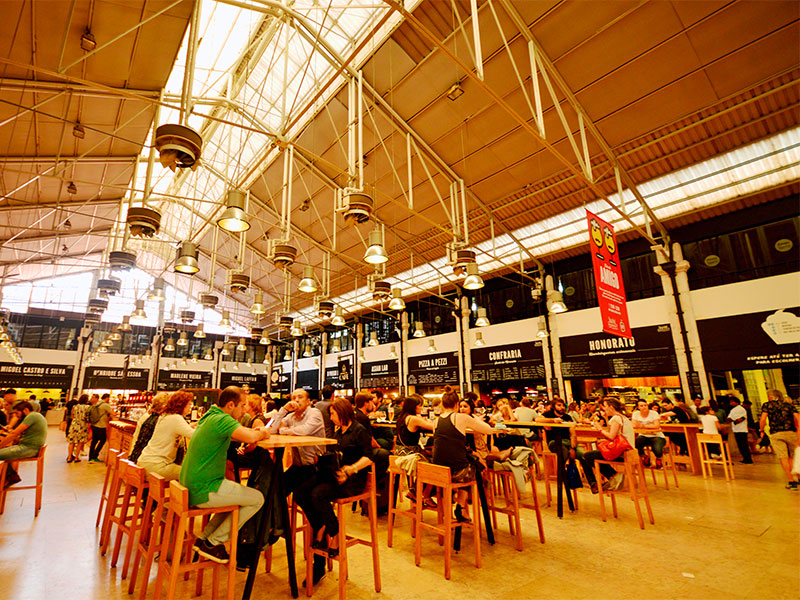 Lisbon Travel Guide: If you're looking to explore a wide range of Lisbon's culinary offerings in one place, head to Mercado da Ribeira. Also known as Time Out Market, this bustling food hall brings together some of the city's best chefs and food stalls, offering everything from traditional Portuguese dishes to international cuisines.